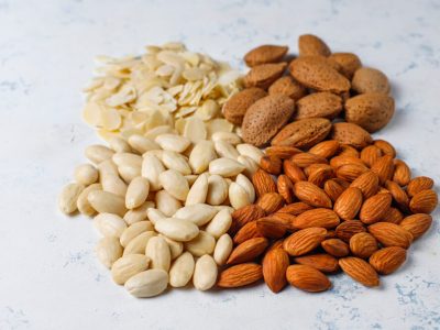 raw-fresh-almonds-with-shell-without-shelll-almond-slices-top-view (1)