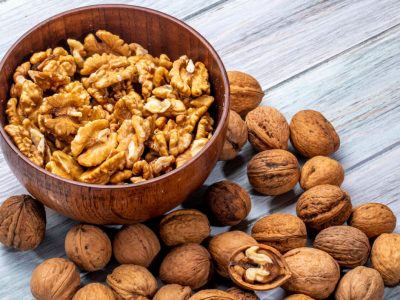 side-view-of-bowl-with-walnuts-on-rustic